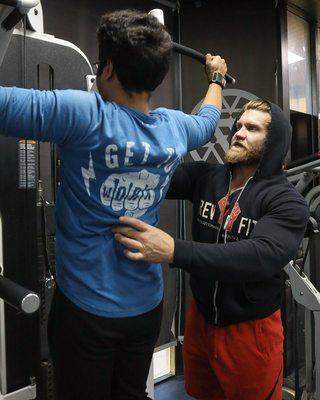 Coach Ryan and Aditya targeting the lats with wide grip pull ups focusing on the negative.