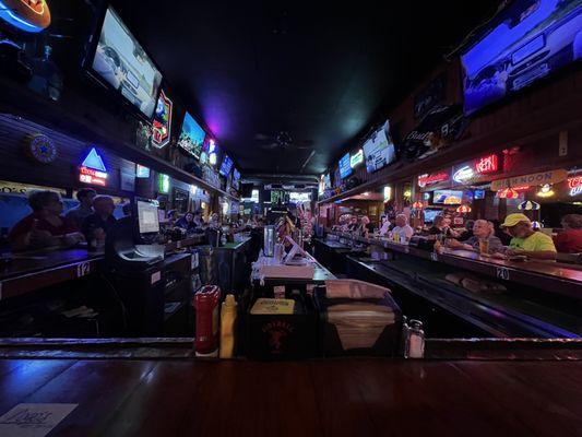 The view from the end of the bar. Lots of TVs.