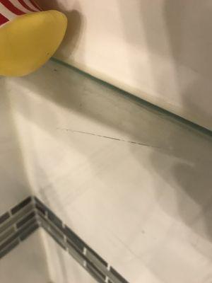 Glass shelf cracked during installation