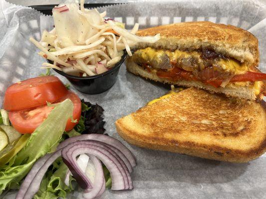 Adult Grilled Cheese. Served on Italion sourdough with fig jam, caramelized onion and roasted red pepper.