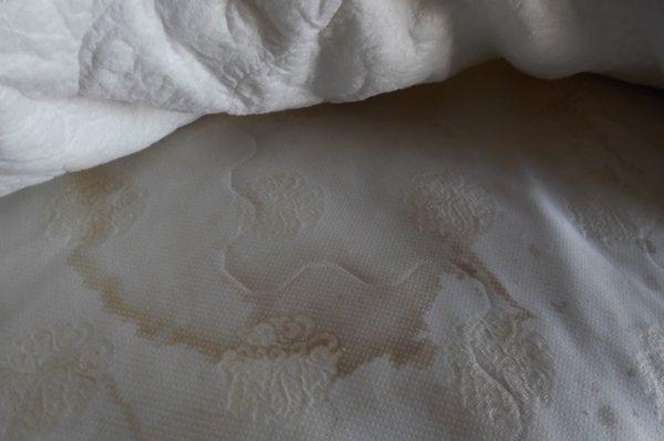 heavily soiled mattress labeled 2005