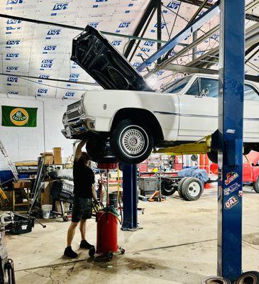 Doing an oil change on a 65 Chevelle.