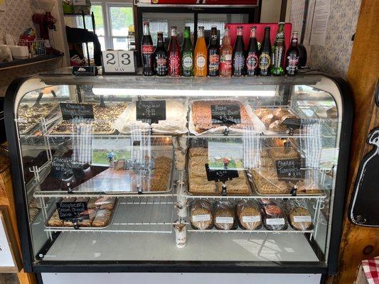 The bakery case full of cookies, pastries, and muffins.