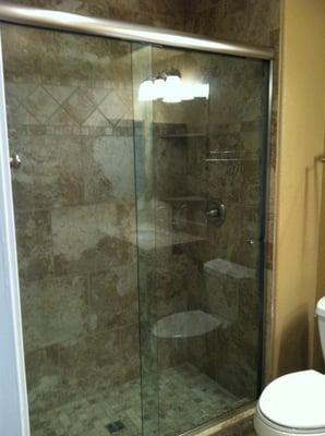 New walk in shower with custom glass doors