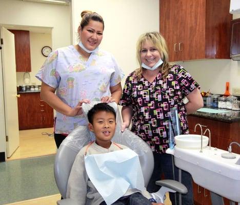 Danielle and Margarita posing a picture with Dr. Hung's son, Kayden.