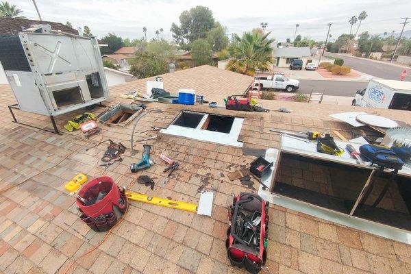 Old A/C unit on the left propped up temporarily. New roof jack location cut.