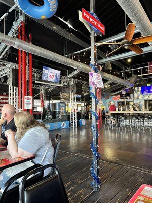 This is a picture of the bar and the floor and people sitting and enjoying their food before the Trump party starts