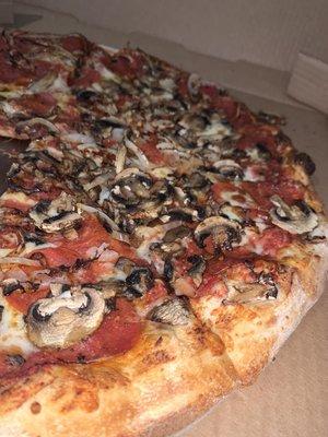 Make your own pizza, add pepperoni and onions, add mushroom to half. Carry out order.