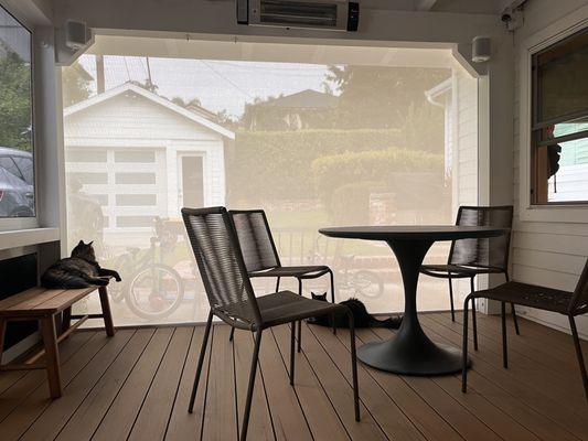 Screened-in porch with the screen closed.