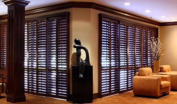 Stained By-pass track system shutters.