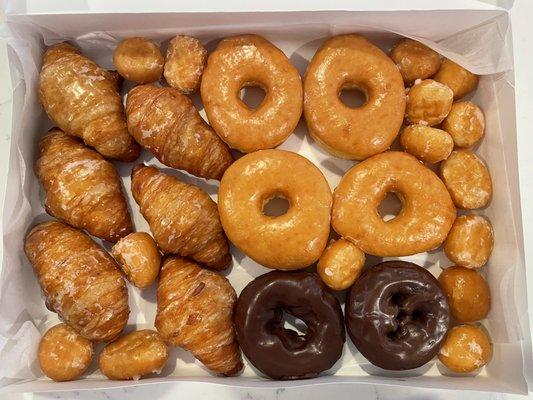 Croissant donuts, glazed, dark chocolate, and of course, their famous mini donuts that they toss on for free with your purchase!