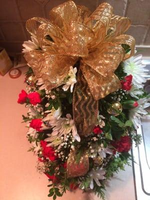 Beautiful Christmas tree shaped boxwood with roses, mums, baby's breath, gold xmas balls and gold ribbon.