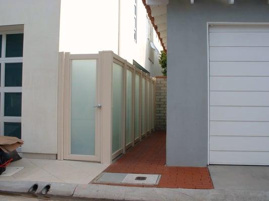 Tan Vinyl with Privacy Glass Fencing