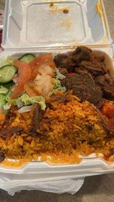 Yellow rice, beef with sauce & salad