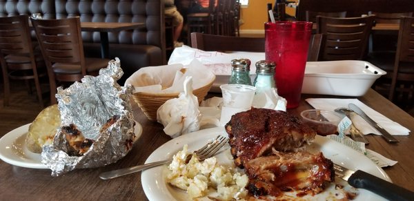 Nice ribs sweet sauce, flaky baked potato, new England Clam Chowder, home made garlic bread.