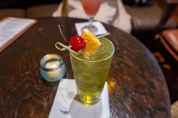 Victora Falls Mist with  Midori Melon Liqueur, Van der Hum Tangerine Liqueur, Banana Liqueur, and sour mix topped with Sprite