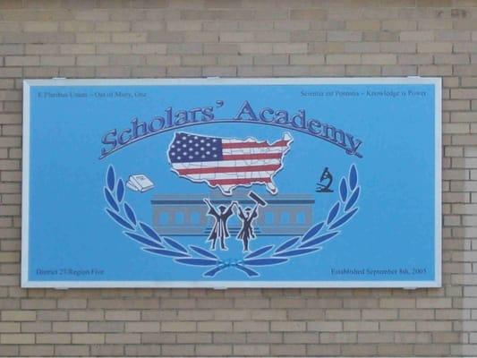 The sign near the main entrance that says "Scholars' Academy."