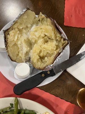 Baked potato with steak knife for reference. I didn't have a banana