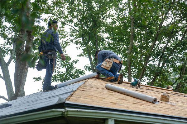 Installing the underlayment.  We use a synthetic underlayment rather than 15 pound roofing felt.