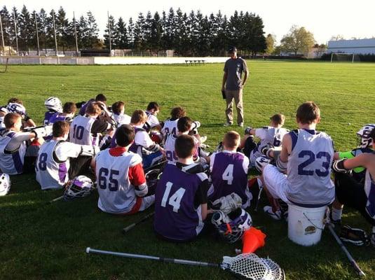 SPINw intern Michael Wilson talks to a high school lacrosse team in Portland, OR