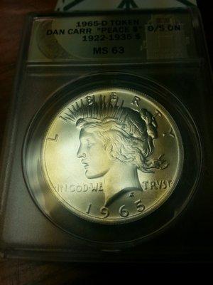 1965 Peace dollar over struck a regular issue Peace dollar. By Dan Carr.