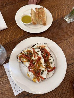 Bruschetta with whipped ricotta gold tomatoes Aleppo chili, and basil