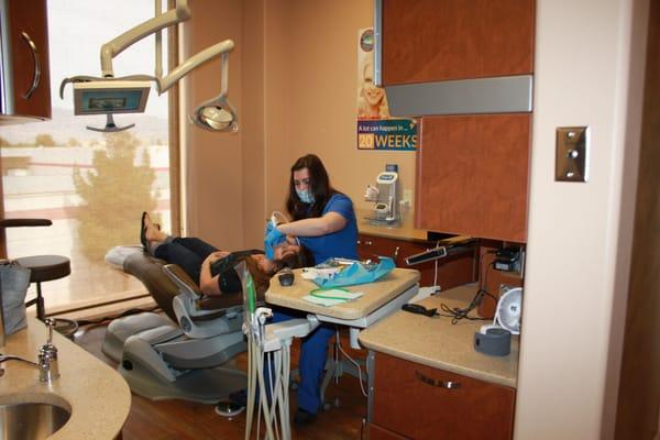 Ashley Taking Intraoral Pictures of Our Patient Teeth