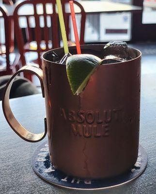 Expert Crown & Ginger Beer in a mule mug with a lime.