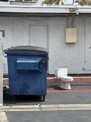 This toilet has been sitting here for over a week. Such a fitting representation of how this place is ran.