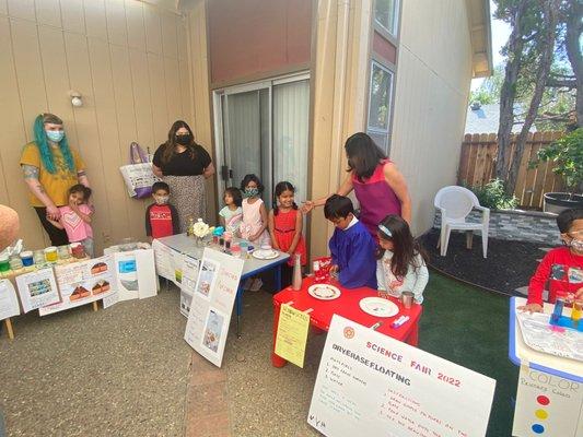 Our Science Fair. Students picked science topics and presented them to their friends and family. Confident public speaking.