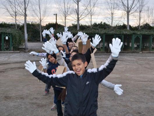 Kids love picking oranges during their tour!