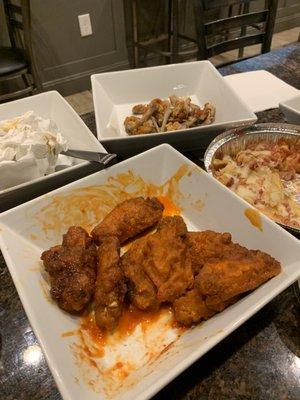 Buffalo wings and cheese fries.