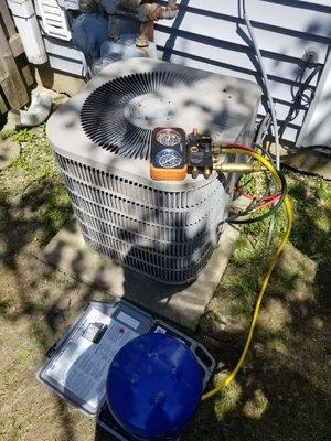 Fixing a leak and recharging a ac unit.