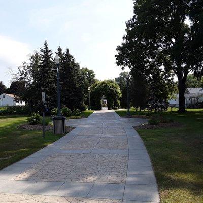 The pathway has dog waste stations, street lights, and cameras.