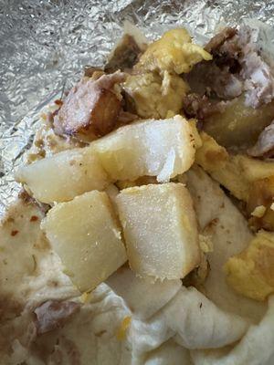 Hard undercooked potatoes and gross chicharrones