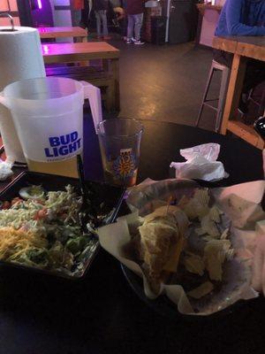 Chef salad and chicken finger sandwich and a pitcher of beer