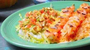 CAMARONES DON JUAN shrimp whit pineapple ,cooked on the grill covered with chipotle cheese and served with rice en salad