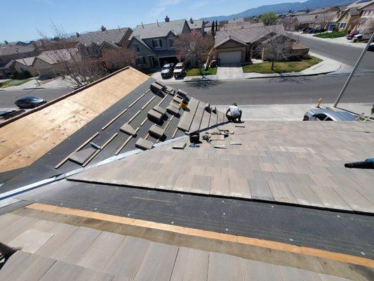 New underlayment installation, flat tile reinstallation, Lancaster, CA.