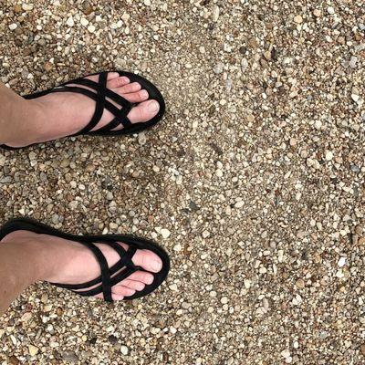 Pebble-y beach surface at Swim Beach #1. Wear water shoes; there is no sand.