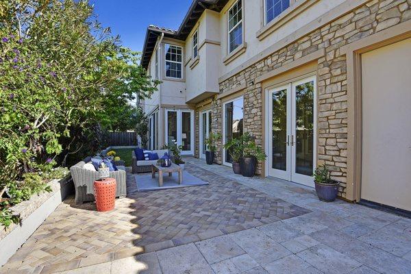 Upgraded backyard with pavers.