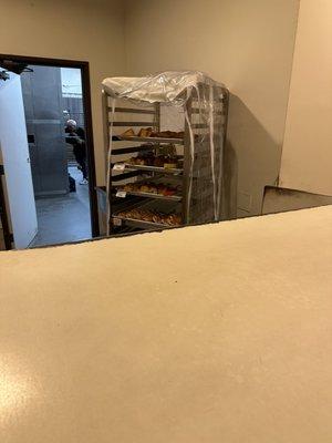 Small baked goods on the rack, big breads in the back room (late night hours)