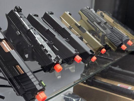 Variety of airsoft GBB pistols.