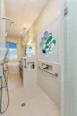 Custom tile barrier free shower with grab bars.