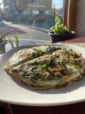 Renoir spinach and feta pizza