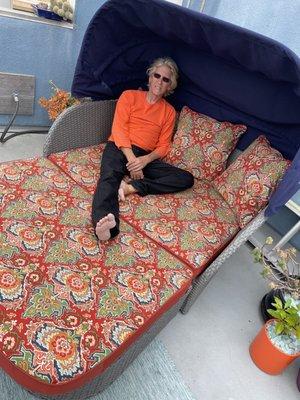 My husband is "modeling" the new upholstery on our beloved patio lounger