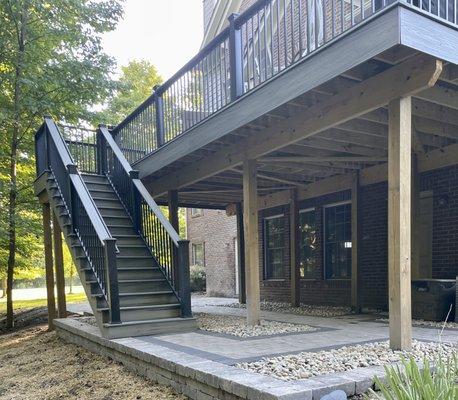 After - deck steps now have a proper landing that ties to the entire backyard.