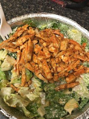 Buffalo chicken over Caesar salad