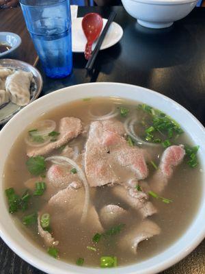 Bowl of beef pho - hot tasty broth, tender beef slices