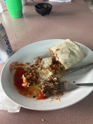 Half eaten asada burrito.