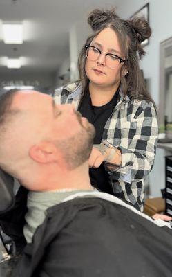 The owner-- Amanda doing a beard trim on a client